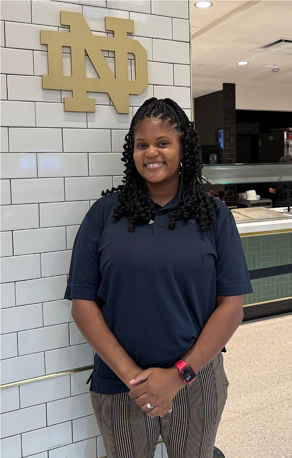 Tora Farris - Operations Manager at South Dining Hall. Photo taken in the food selection area of South Dining Hall.